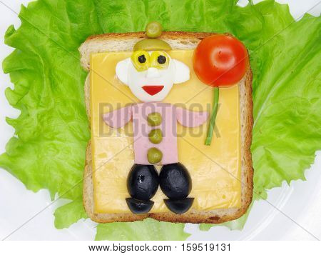 creative sandwich with cheese and salame man shape