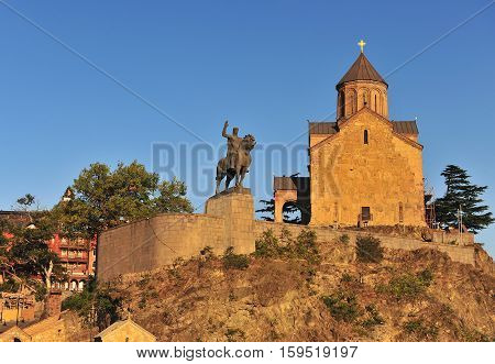 Metekhi Church and the equestrian statue of King Vakhtang Gorgasali on sunset Tbilisi Georgia