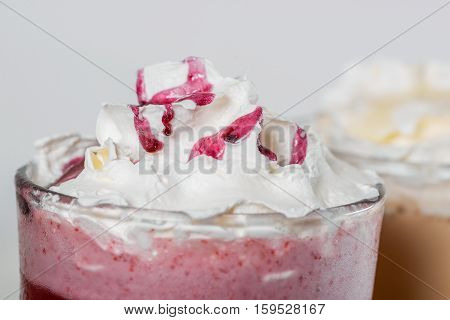 Milkshake shot close-up on a wooden background in the decoration