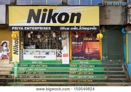 Nilgiri Hills India - October 25 2013: photography equipment shop downtown with colorful advertisements for Sony Nikon Fuji and other brands.