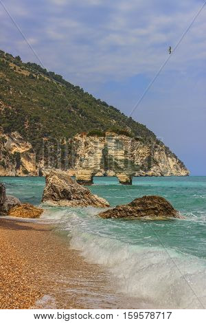 Baia dei Mergoli beach .MATTINATA (Apulia), - ITALY-Also known 'Baia Delle Zagare' (Orange flowers bay),the beach is doulbetless one of de most renowned seaside resort in the Gargano's promontory.