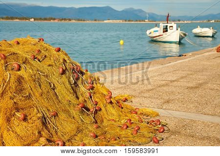 Pile Of Yellow Fishing Nets In Port