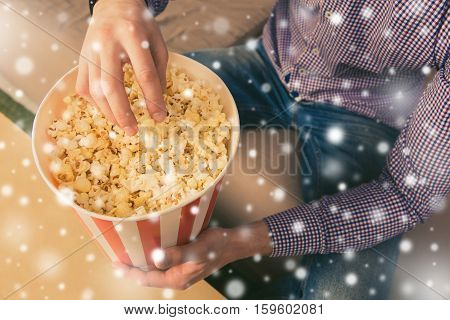 Close Up Photo Of Young Man Eating Popcorn On New Yerar Holidays