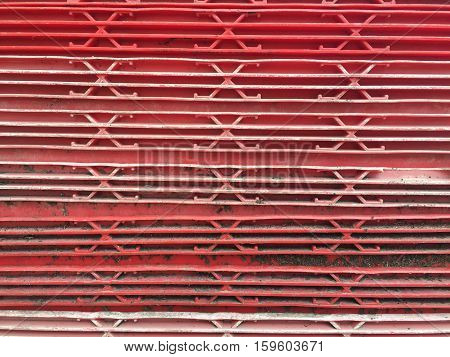Dirty red plastic container abstract background texture