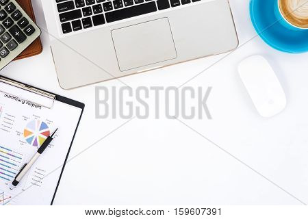 Modern White office desk table with laptop computermousepencalculatorleather notebookanalysis chart or graph and cup of coffee.Top view with copy space.Working desk table concept.