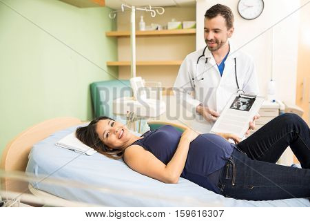 Happy Pregnant Woman In A Hospital Bed
