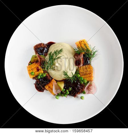 Pulled pork with grilled vegetables isolated on black background