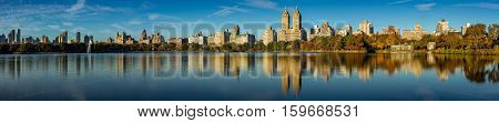Fall in Central Park at the Jacqueline Kennedy Onassis Reservoir. Panoramic Early morning view on the Upper West Side Manhattan New York City