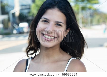 Beautiful caucasian woman outdoor in the city in the summer