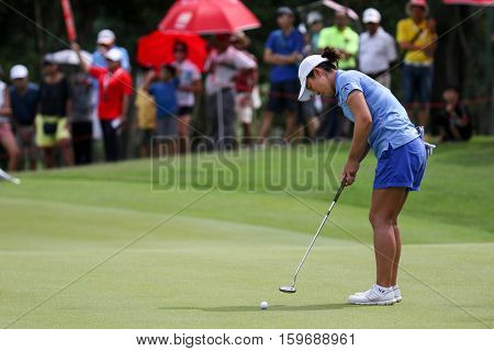 KUALA LUMPUR, MALAYSIA - OCTOBER 29, 2016: Candie King of Chinese Taipei putts at the green of the TPC Golf Course at the 2016 Sime Darby LPGA Malaysia golf tournament.