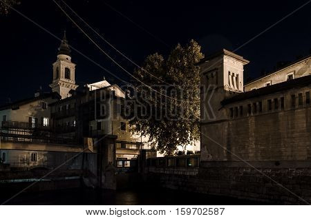 night view of a traditional village on italian alps Borgo Valsugana