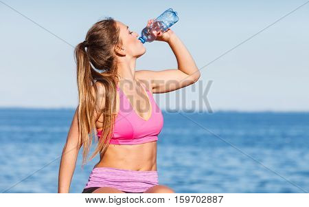 Woman Drinking Water After Sport Gym Outdoor