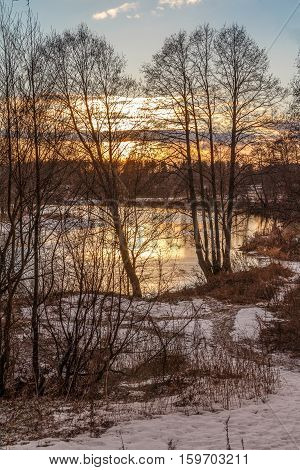 Sunset in March over the river, the ice on it almost melted