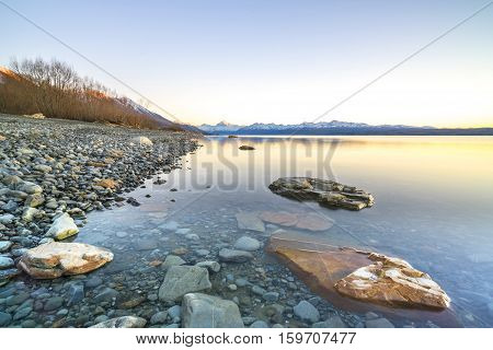 Lake stone and rock during sunrise moment