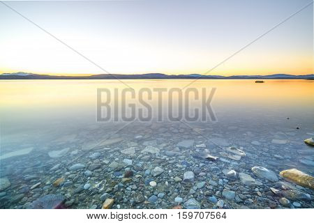 Lake stone and rock during sunrise moment