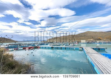 Salmon Fish farm floating on the glacial waters of Wairepo Arm Twizel South Island New Zealand