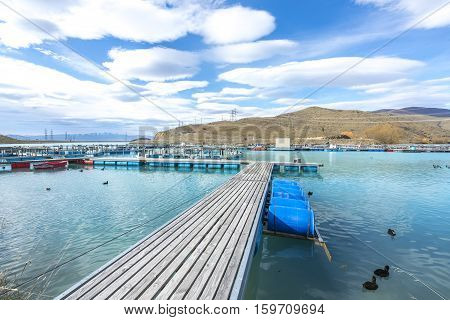 Salmon Fish farm floating on the glacial waters of Wairepo Arm Twizel South Island New Zealand