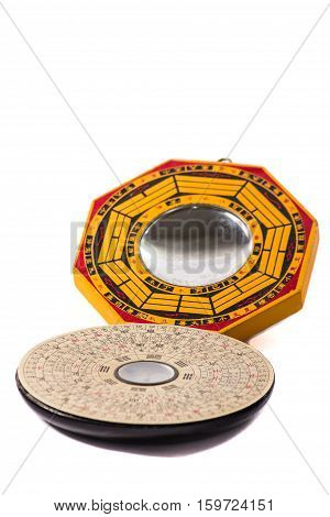 traditional feng shui mirror wood and compass isolated on pure white background