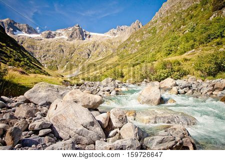 Rapid brook in Swiss Alps near Sustenpass mountain road, Switzerland