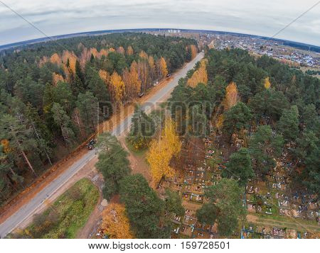 Aerial view of the road past the village cemetery. Shooting from height of the bird's flight. Maksatikhinsky District Tver Region. Съемки с высоты птичьего полета. Максати