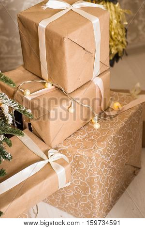 New year. Christmas gifts Packed in craftool paper. A sense of celebration
