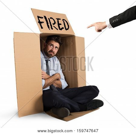 Desperate and fired businessman hides in the cardboard