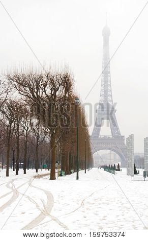 Snowy day in Paris - misty Eiffel Tower and lots of snow