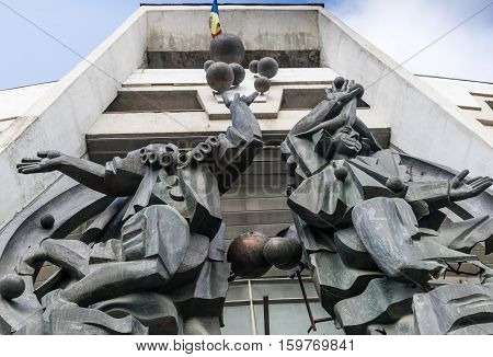 MARCH 2015 - CHISINAU, MOLDOVA: Figures on facade of abandoned soviet theater in Chisinau, Moldova March 2015