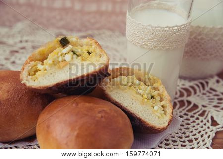 fresh pies with milk on light background