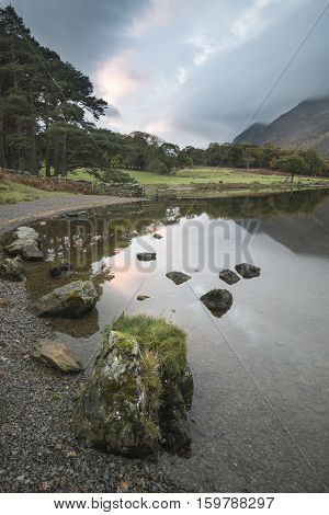 Beautiful Autumn Fall Landscape Image Of Crummock Water At Sunrise In Lake District England