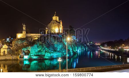 Night Evening Illuminated View Of The Metekhi Church And The Equestrian Statue Of King Vakhtang Gorg