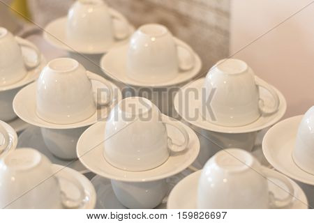 many white empty coffee cup preparation for coffee break of wedding eventselective focus.