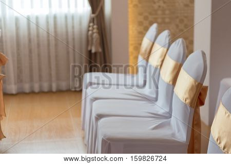 beautiful chairs decoration with ribbon in wedding event hallselective focus.