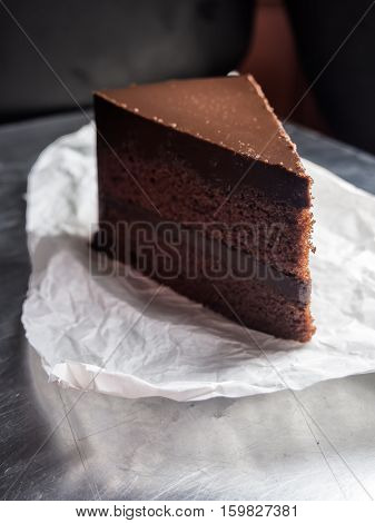 piece of dark chocolate fudge cakeselective focus.
