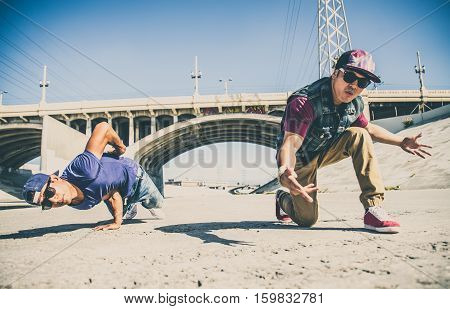 Two bbys ding some stunts - Street artist breakdancing outdrs