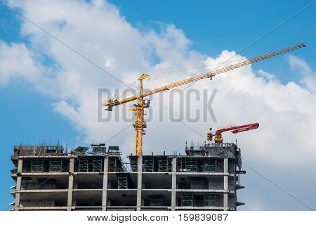 Tower Crain Construction Building In Blue Sky