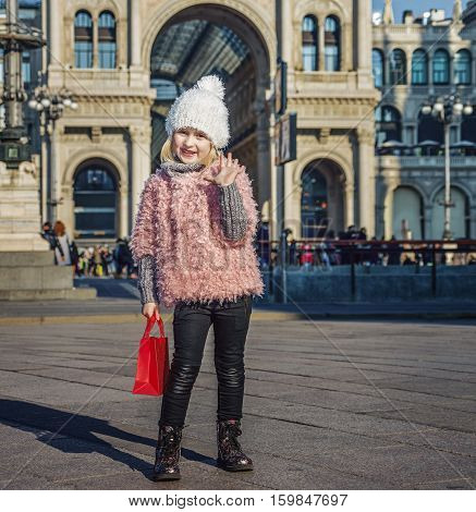 Happy Girl At Piazza Del Duomo In Milan, Italy Handwaving
