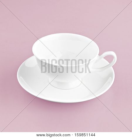 white coffee cup on pink background solid