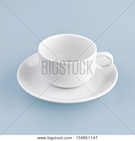 white coffee cup on blue background solid