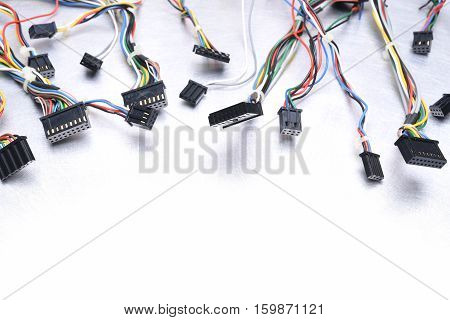 Computer cables on the white and metal table