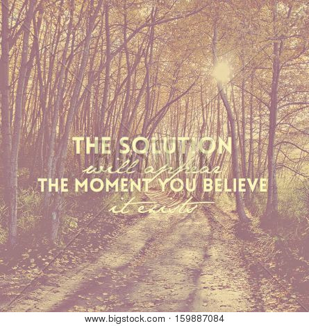 Inspirational quote on forest landscape.  Sunshine through tall skinny tree branches along forest path in autumn season. Green foliage, fallen leaves and shadows on trail. Blurred instagram effects.