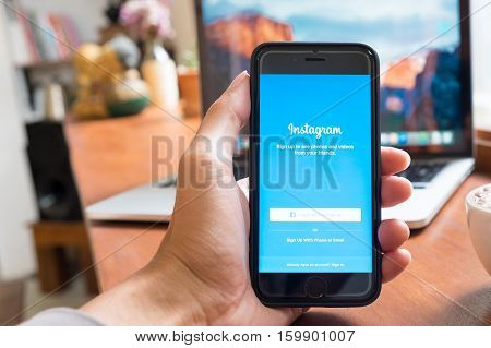 CHIANG MAI THAILAND - OCT 4 2016: A man hand holding iPhone 6S with instagram application. Instagram is largest and most popular photograph social networking.
