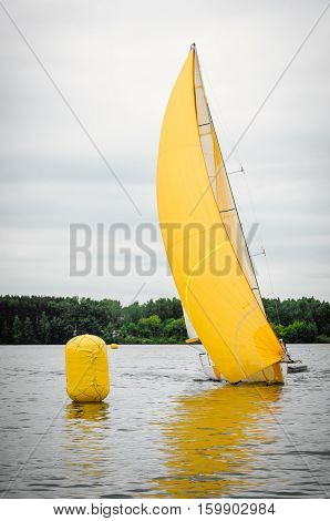 Sailing yacht race. Team athletes participating in the sailing competition