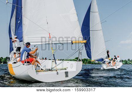 Sailing yacht race. Team athletes participating in the sailing competition
