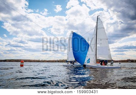 Sailing yacht race. Team athletes participating in the sailing competition