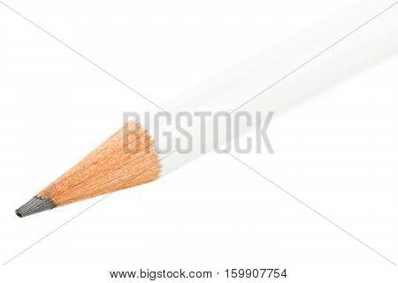 White pencil close up macro with selective focus on graphite tip isolated on white background