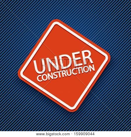 illustration of red sign under condtruction lying on blue jeans texture