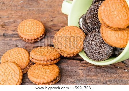 cookies cream brown in cup on woodden table