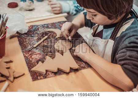 children's hands sculpts clay crafts pottery school