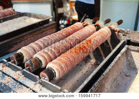 Trdelnik bakery on the street market in Prague, Czech Republic. Czech sweetness